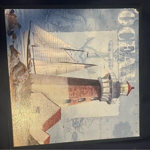 Kirklands Coastal Lighthouse and Sailboat Art in Blue and Red